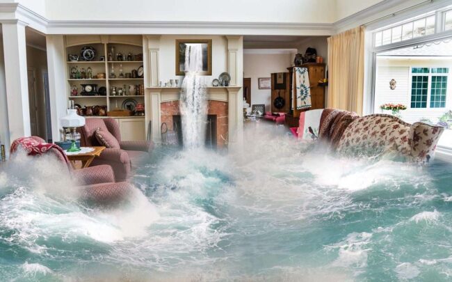 Living room flooded with water, showcasing furniture submerged and a waterfall feature, illustrating plumbing disaster and the importance of timely plumbing services.