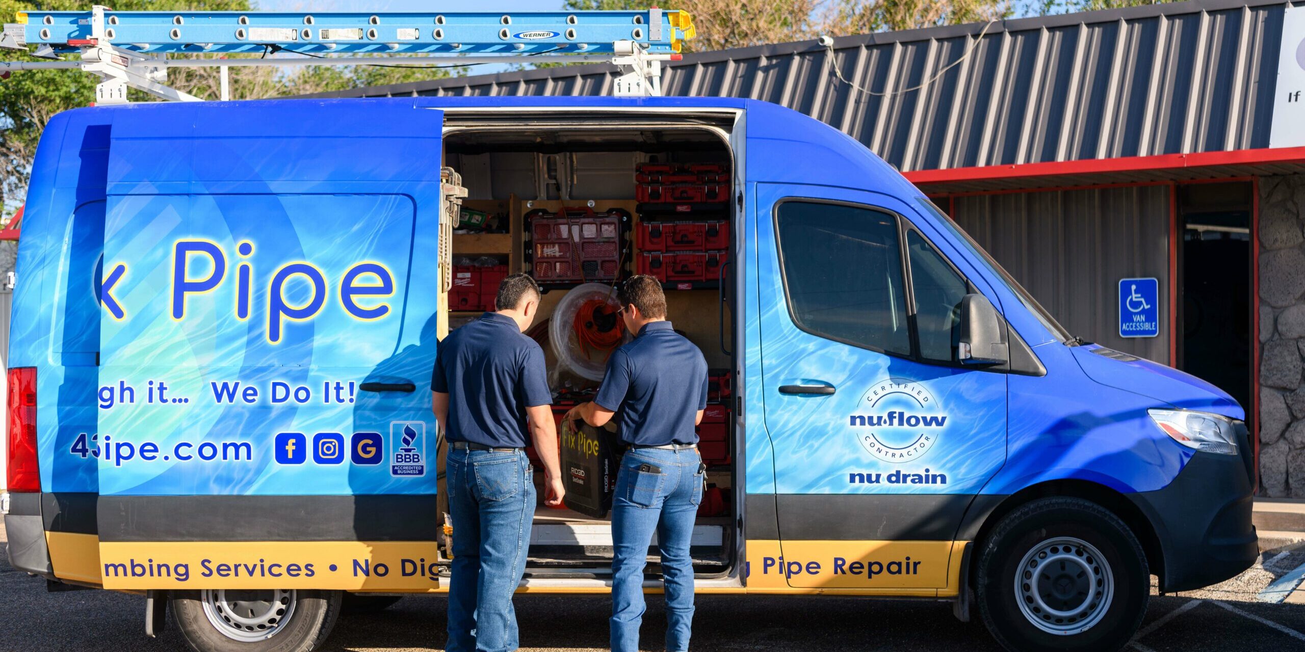 I Fix Pipe service van with technicians loading plumbing equipment, showcasing trenchless pipe repair services.