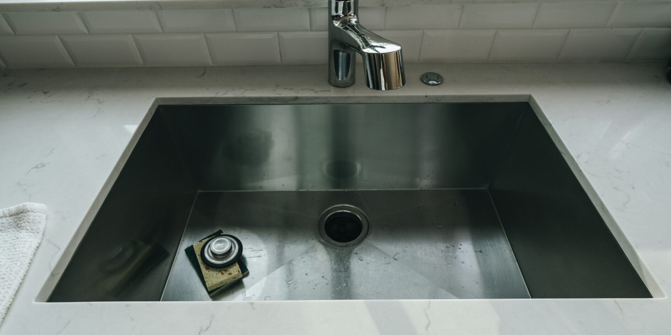 a stainless steel kitchen sink
