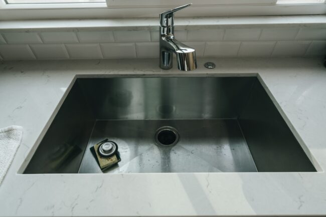 a stainless steel kitchen sink